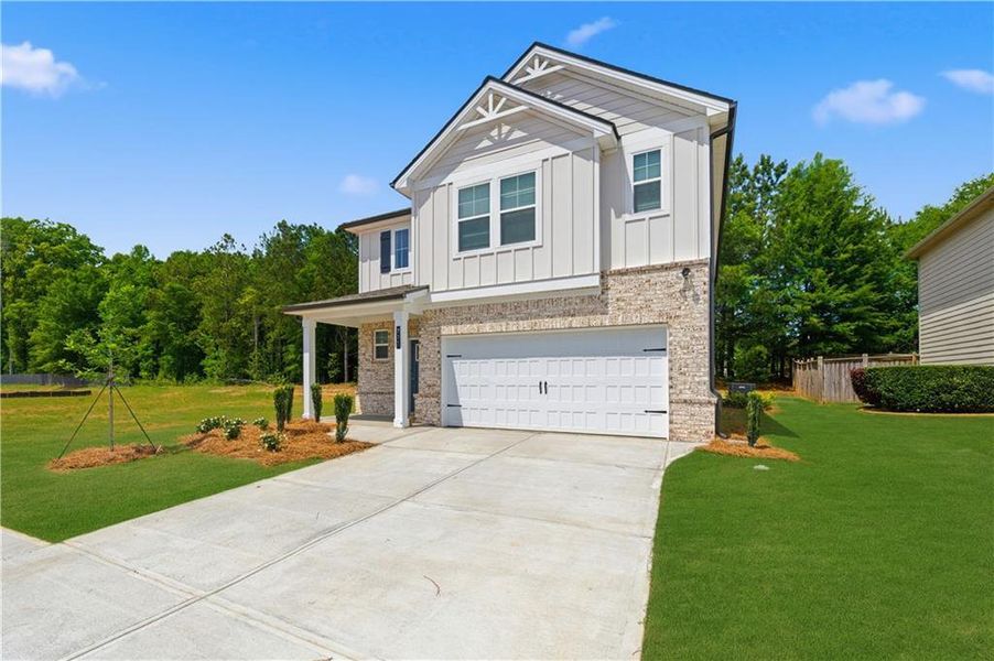 Front exterior of a new home in Westminster, Covington, GA, highlighting curb appeal (Image 23).