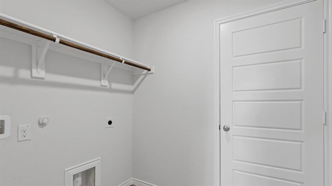 Laundry room with gas dryer hookup, hookup for an electric dryer, and hookup for a washing machine