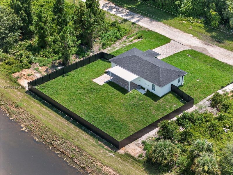 Front exterior of a new home in , Lehigh Acres, FL, highlighting curb appeal (Image 17).
