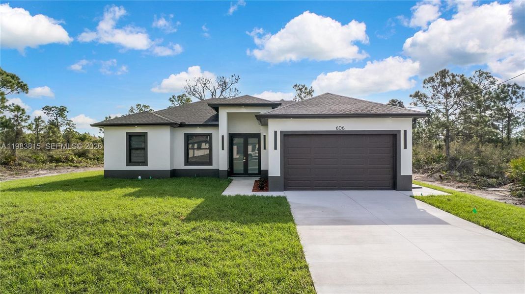 Front exterior of a new home in , Lehigh Acres, FL, highlighting curb appeal (Image 1). Front exterior of a new home in , Lehigh Acres, FL, highlighting curb appeal (Image 1).