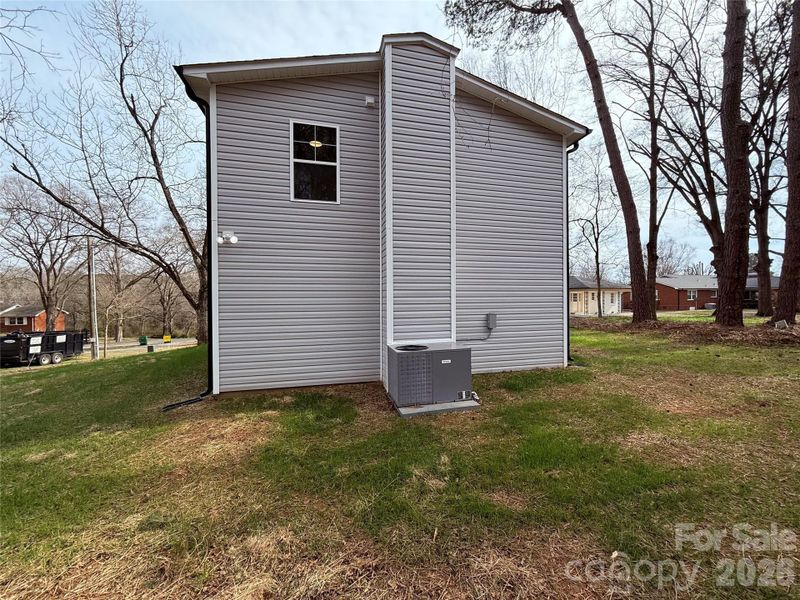 Exterior details and patio area of a home in , Oakboro (Image 20).