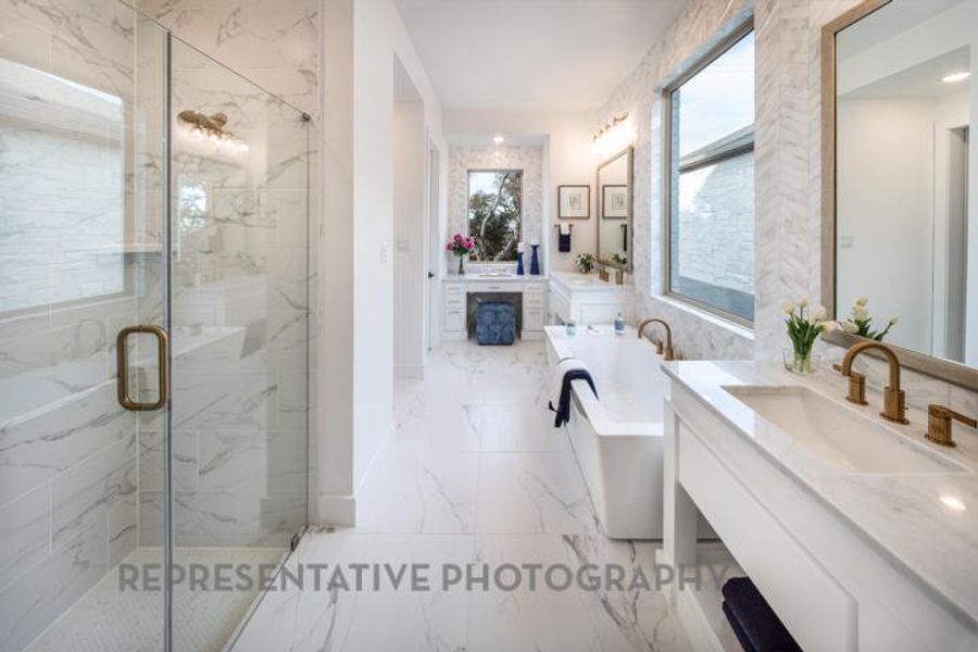 Full bathroom with a marble finish shower, marble finish floor, a soaking tub, and vanity Full bathroom with a marble finish shower, marble finish floor, a soaking tub, and vanity