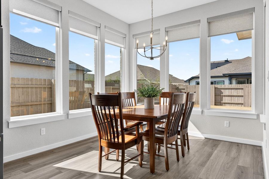 Dining room featuring windows all around for plenty of natural light