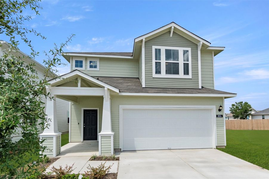 View of front of property with an attached garage, driveway, and roof with shingles