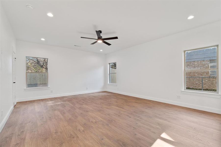 Spare room with light hardwood / wood-style floors and ceiling fan