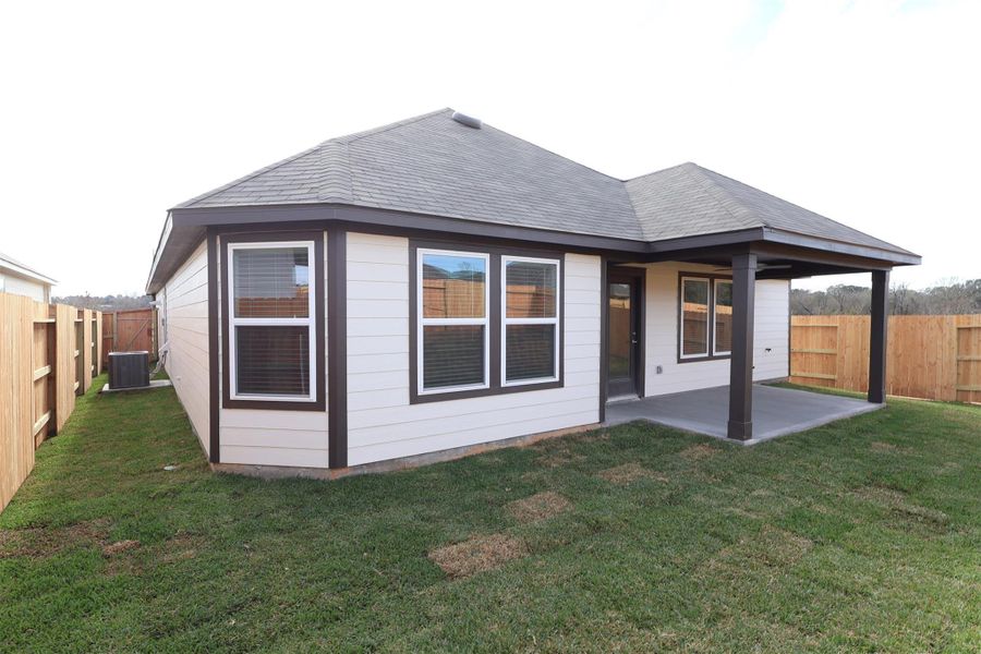Exterior details and patio area of a home in Lone Star Landing, Montgomery (Image 4). Exterior details and patio area of a home in Lone Star Landing, Montgomery (Image 4).