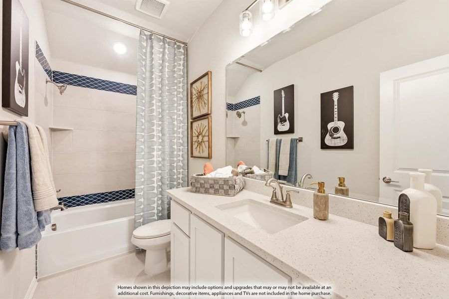 Bathroom with white vanity, quartz countertop, single sink, and tub-shower combo with patterned curtain