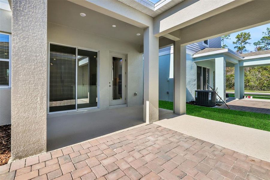 Exterior details and patio area of a home in Serenade at Ovation, Winter Garden (Image 4).