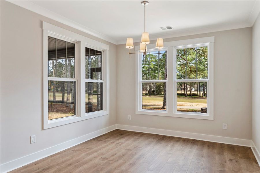 This bright room features beautiful flooring and c