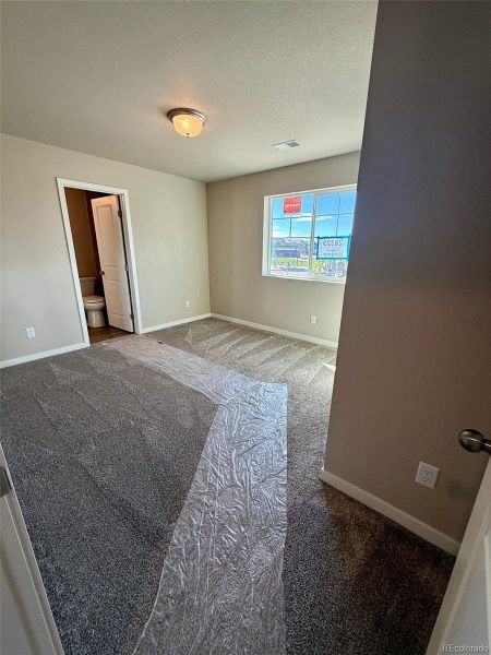 Spacious, unfurnished interior of a new home in Sky Ranch - Highland Collection, Watkins (Image 12).