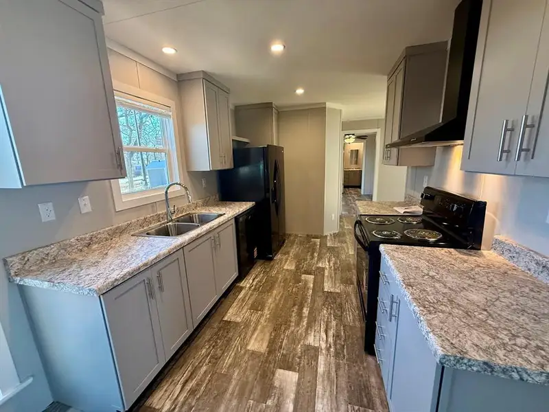Furnished interior view inside a new home in , Pelican Bay (Image 3).