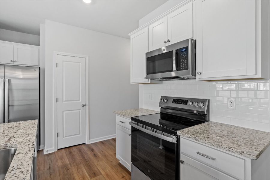 Furnished interior view inside a new home in West Main Townhomes, Sanford (Image 7).