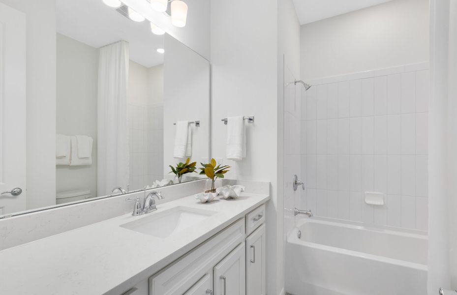 Representative furnished interior of a home built from the Concord by DiVosta in Emerson Oaks, Vero Beach (Image 15).