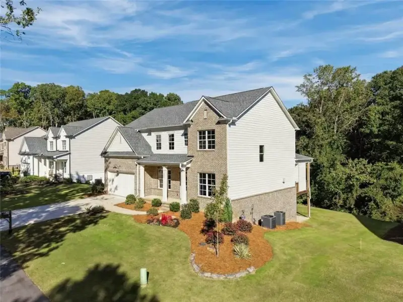 Front exterior of a new home in , Sugar Hill, GA, highlighting curb appeal (Image 2). Front exterior of a new home in , Sugar Hill, GA, highlighting curb appeal (Image 2).