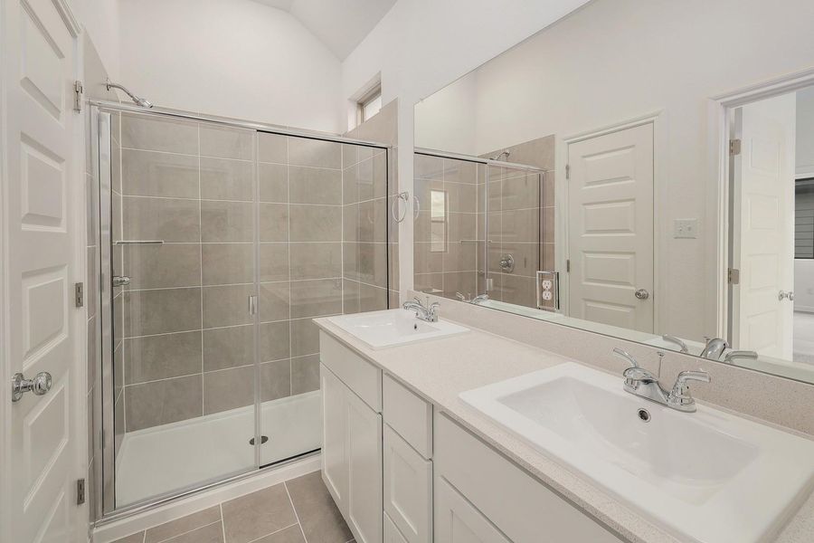 Primary Bathroom in the Ash home plan by Trophy Signature Homes – REPRESENTATIVE PHOTO Primary Bathroom in the Ash home plan by Trophy Signature Homes – REPRESENTATIVE PHOTO