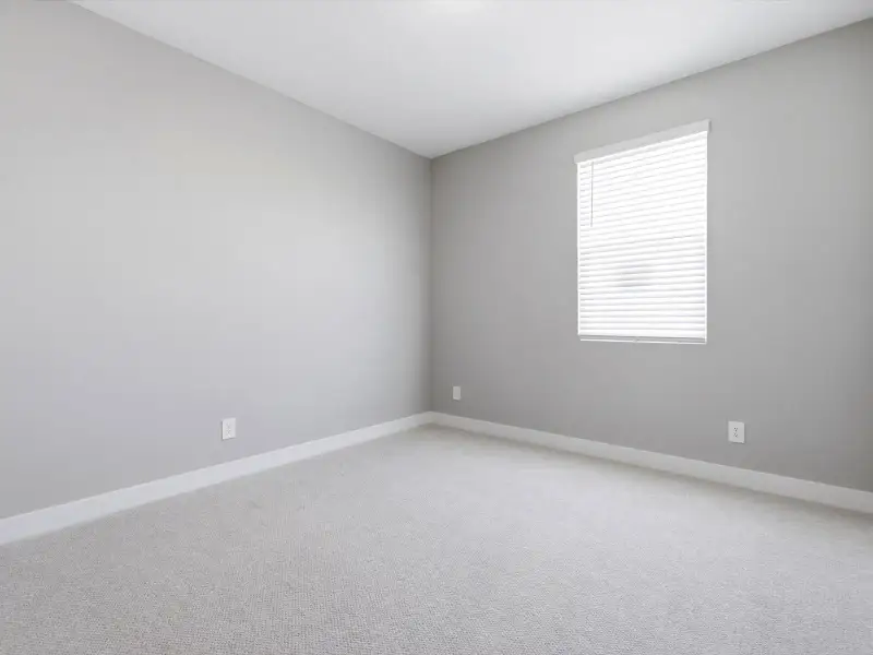 Spacious, unfurnished interior of a new home in Blossom Rock Reserve Series, Apache Junction (Image 18).