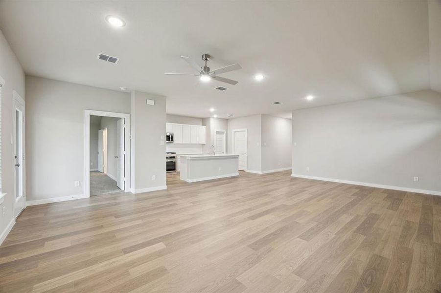 Living Room in the Oscar home plan by Trophy Signature Homes – REPRESENTATIVE PHOTO