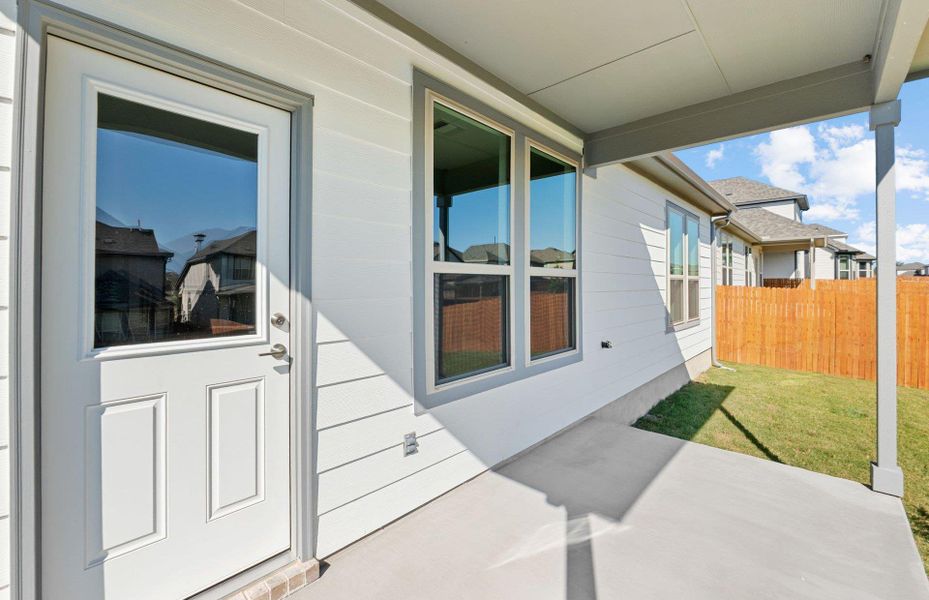 Exterior details and patio area of a home in Saddleback at Santa Rita Ranch, Liberty Hill (Image 18). Exterior details and patio area of a home in Saddleback at Santa Rita Ranch, Liberty Hill (Image 18).