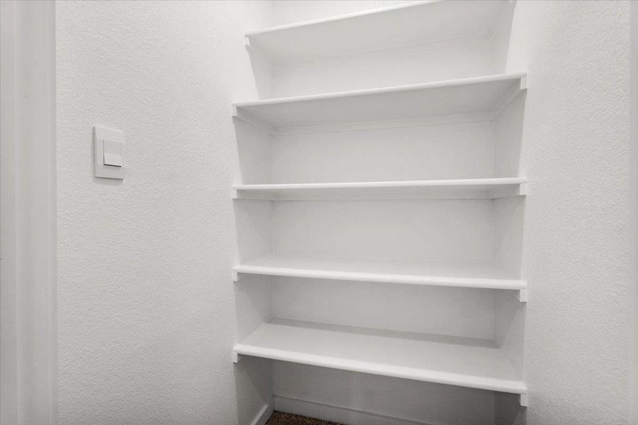 Organized built-in shelving provides ample storage solutions.