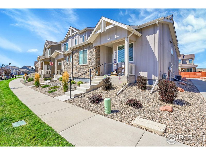 Front exterior of a new home in , Loveland, CO, highlighting curb appeal (Image 19).