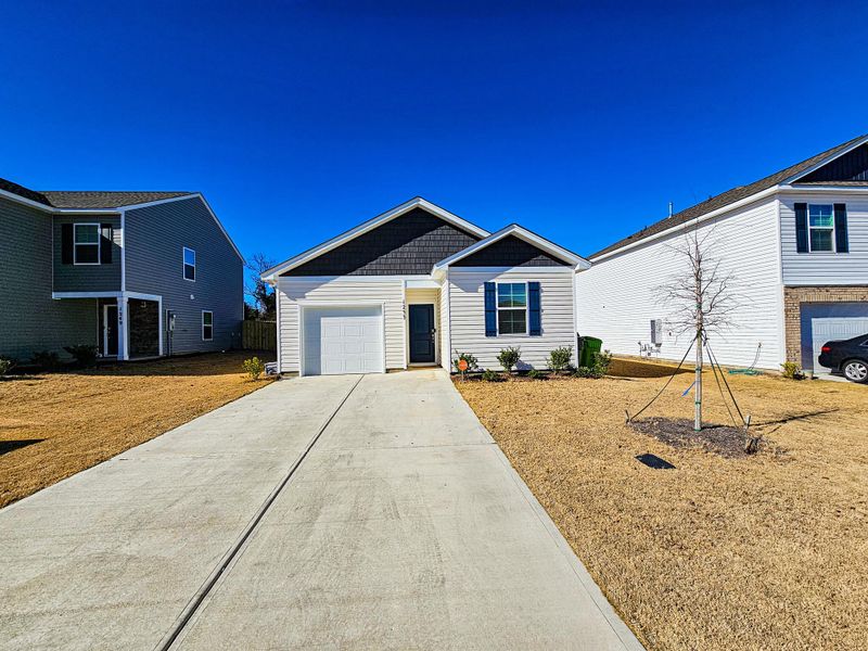 Front exterior of a new home in , Columbia, SC, highlighting curb appeal (Image 24).