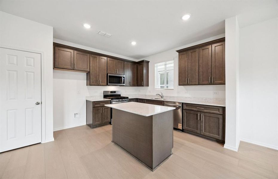Spacious kitchen with eat-in bartop island