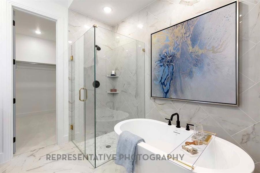 Full bathroom with a marble finish shower, tile walls, a soaking tub, marble finish floors, and recessed lighting
