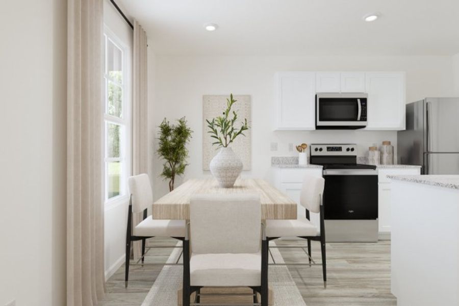 A kitchen with a dining table and chairs. A kitchen with a dining table and chairs.