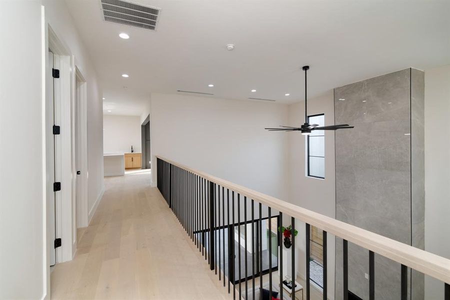 Hall featuring light wood-type flooring