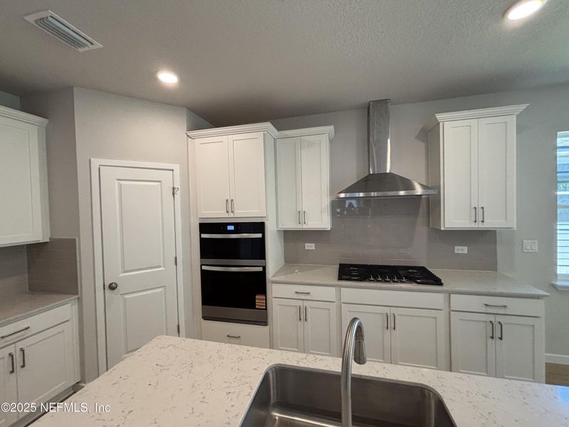 Furnished interior view inside a new home in The Magnolia Series at Reserve East, Flagler Beach (Image 7).