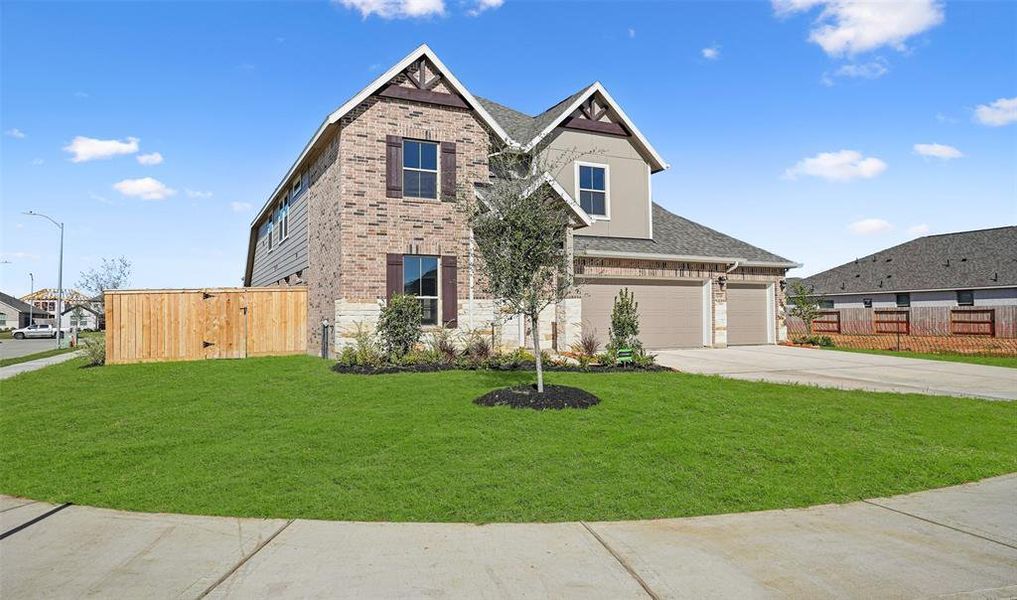 Two-story home with 4 bedrooms, 3 baths and 3 car garage on a corner lot