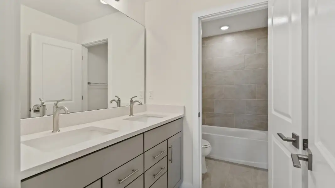 The Naples Second Floor Second Bathroom in Quick Move-In Home at Willowbrook North by DRB Homes in Winter Haven, FL