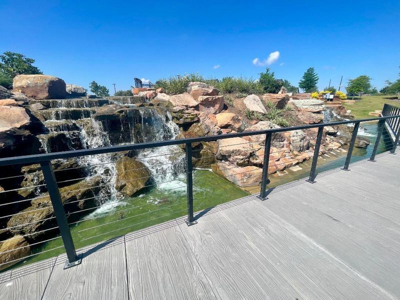 This is the waterfall you see at a distance in the first picture.  It flows straight towards you.