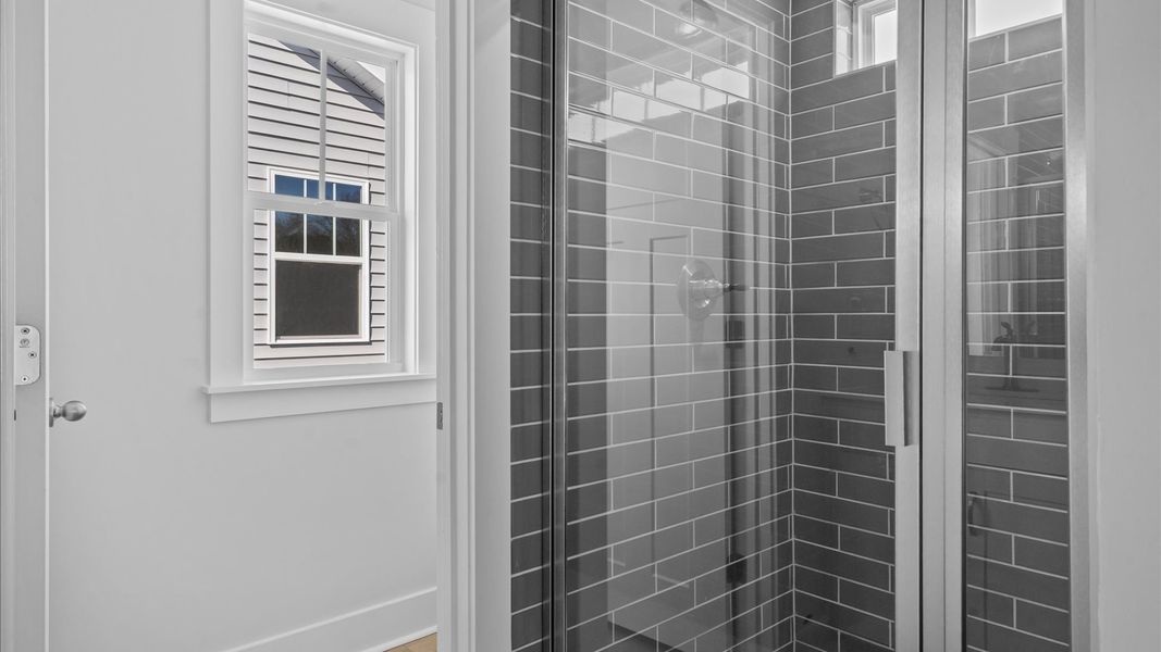 Superior en-suite primary bathroom with stylish dual vanity and walk-in shower crafted with high standards in mind
