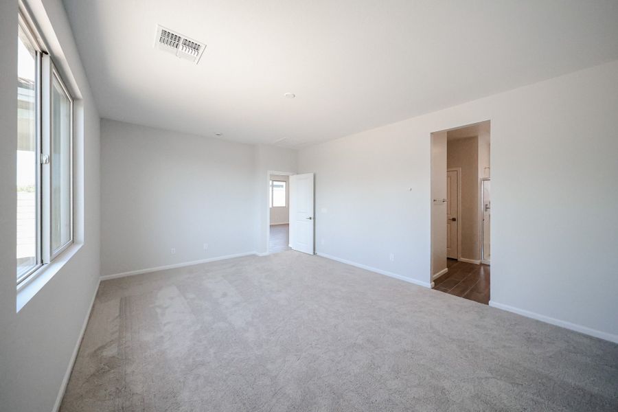 A hallway with white walls.