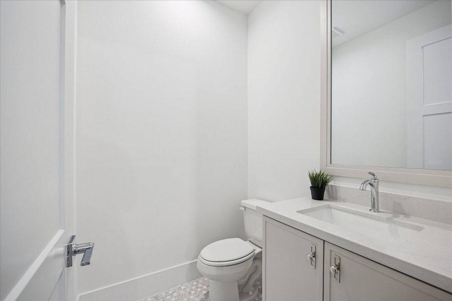 Powder room found off living/kitchen.