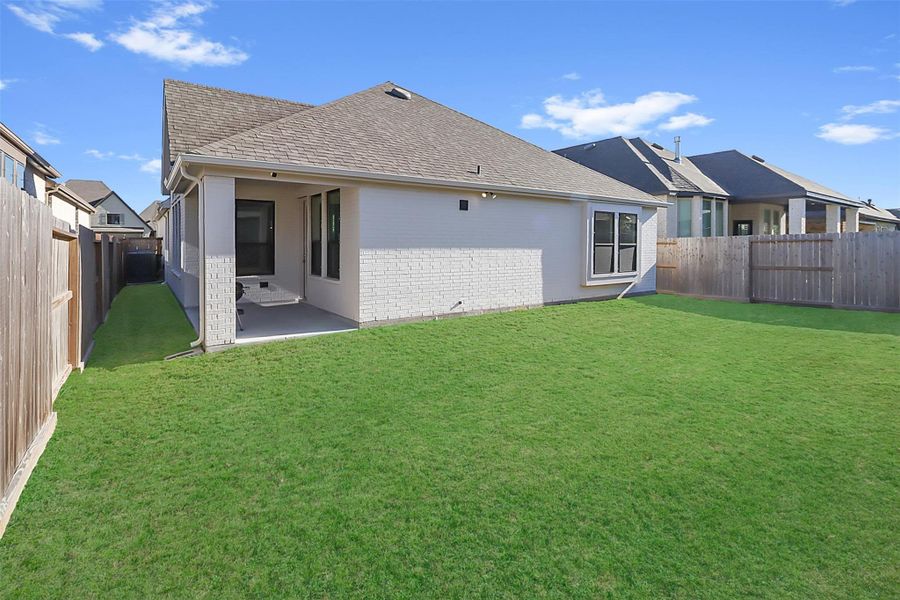 Exterior details and patio area of a home in Riceland: 50ft. lots, Mont Belvieu (Image 25).