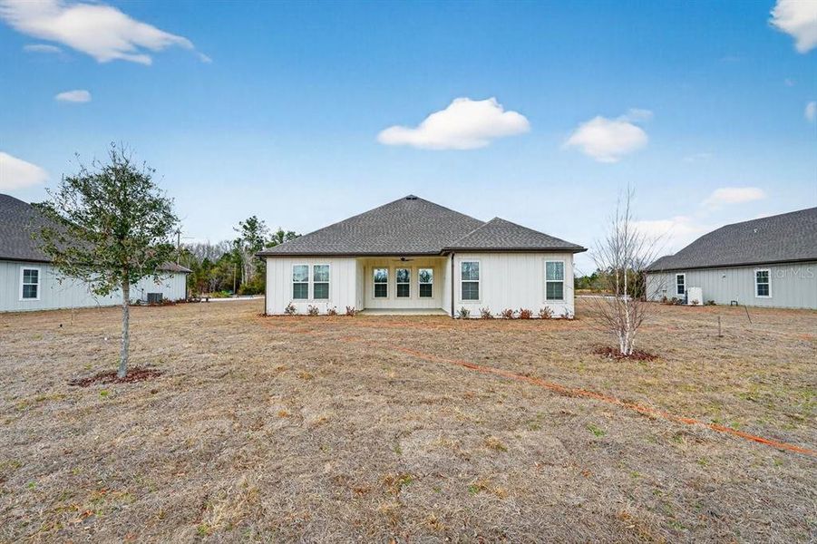 Exterior details and patio area of a home in Stables at Cary Forest, Bryceville (Image 25).