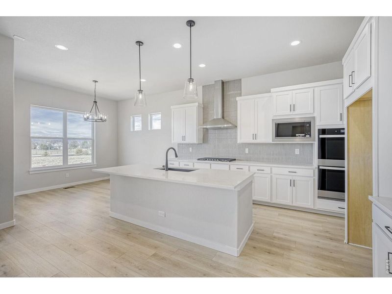 Furnished interior view inside a new home in RainDance, Windsor (Image 8).