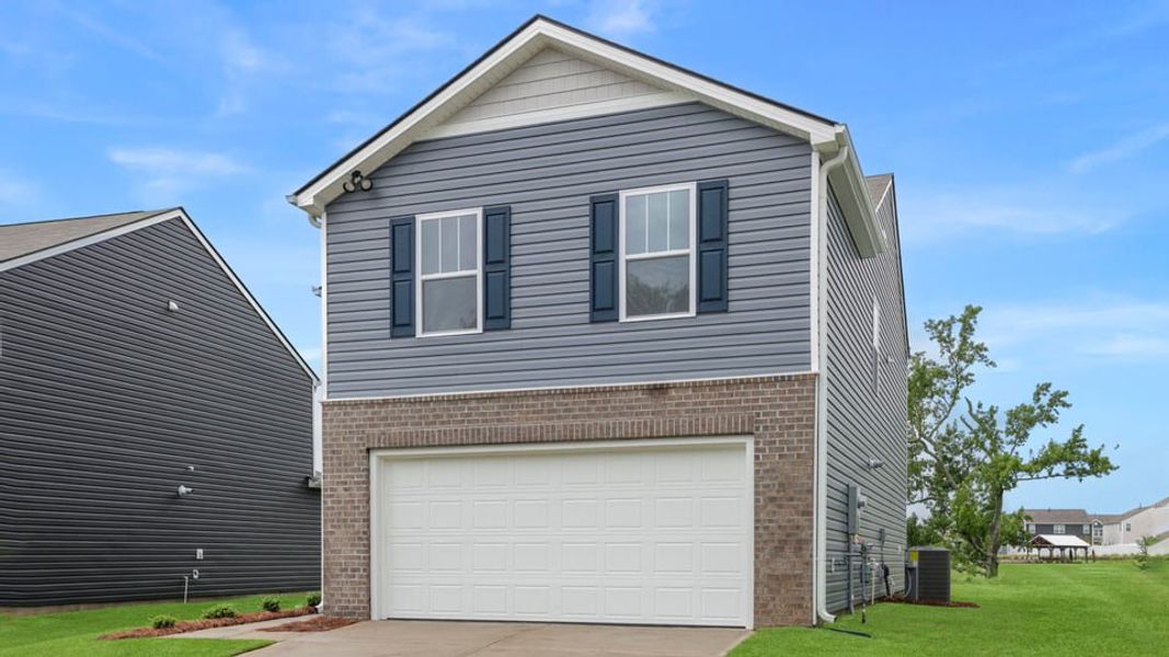 Front exterior of a new home in Durbin Meadows, Fountain Inn, SC, highlighting curb appeal (Image 2). Front exterior of a new home in Durbin Meadows, Fountain Inn, SC, highlighting curb appeal (Image 2).