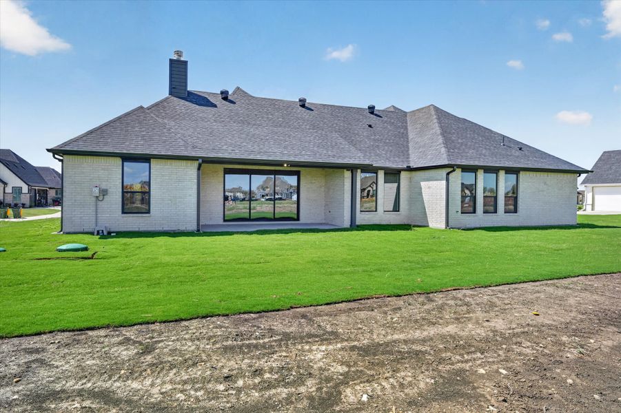 Exterior details and patio area of a home in Paloma Ranches, Justin (Image 4).