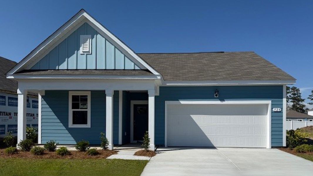 Front exterior of a new home in Carrington Woods, Longs, SC, highlighting curb appeal (Image 2). Front exterior of a new home in Carrington Woods, Longs, SC, highlighting curb appeal (Image 2).