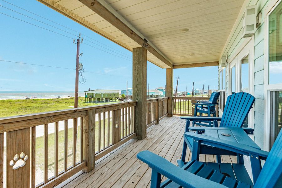 Generous outdoor living area provides multiple seating options and an inviting space for morning coffee or evening sunsets.