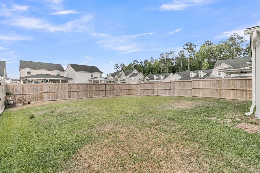 Exterior details and patio area of a home in Sweetgrass at Summers Corner, Summerville (Image 24).