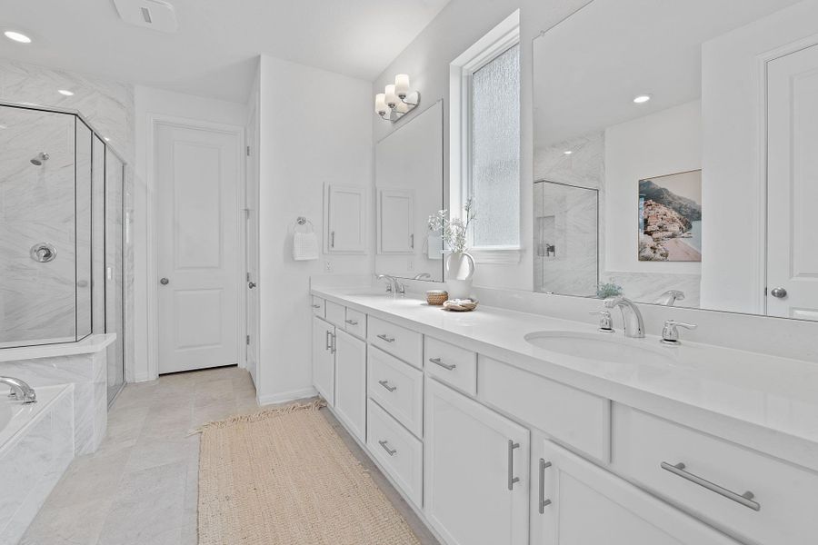 Full bathroom with a marble finish shower, double vanity, a garden tub, recessed lighting, and tile patterned floors