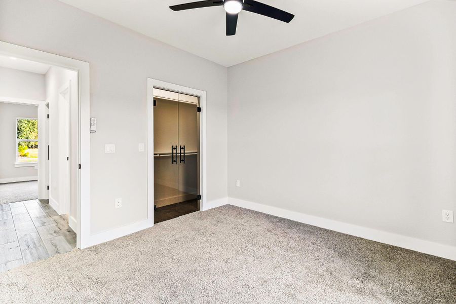 Bedroom with glass closet doors. Bedroom with glass closet doors.