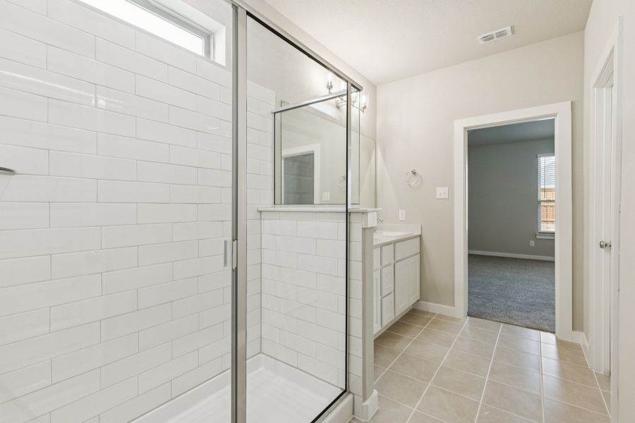 Primary Bathroom in the Stanley II home plan by Trophy Signature Homes – REPRESENTATIVE PHOTO