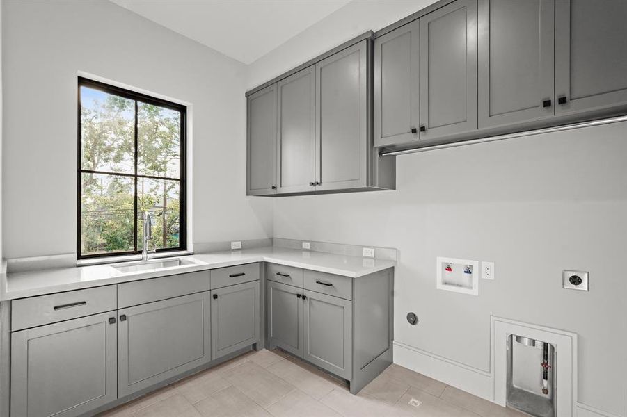 Just off the game room is the spacious and well-lit laundry room!