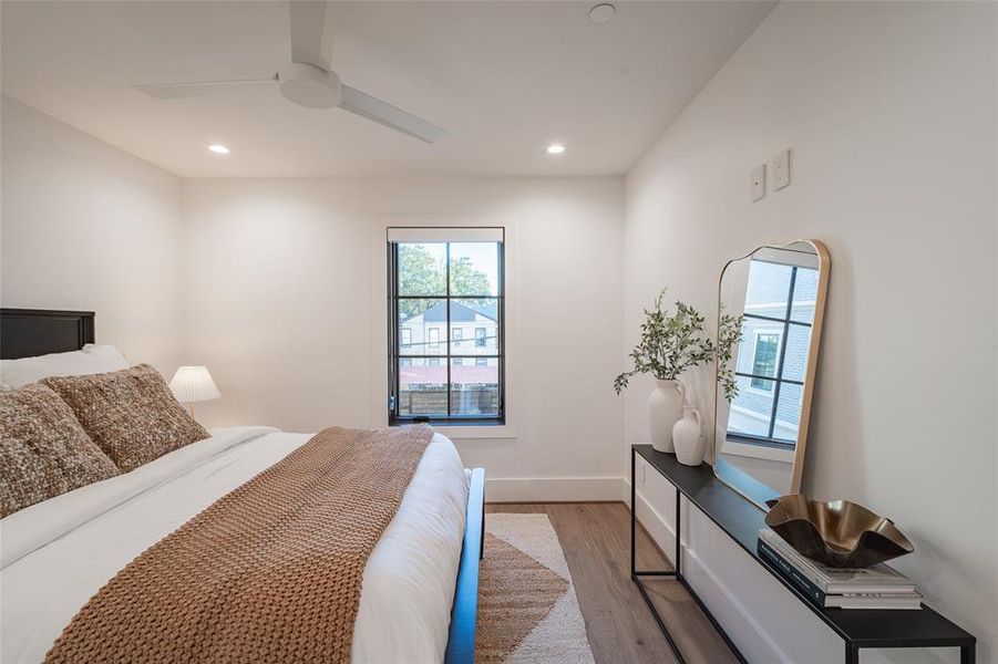 Bedroom with light wood-type flooring and ceiling fan