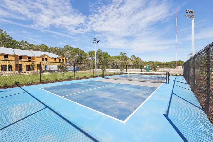 Challenge friends to a game of pickleball on the community court